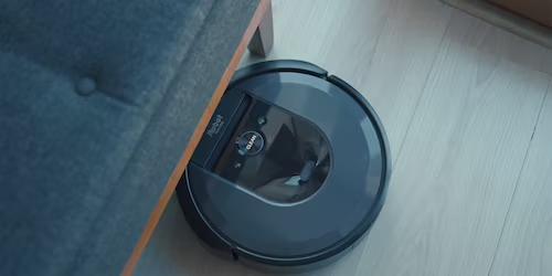 Image showing a Roomba working and cleaning the floor